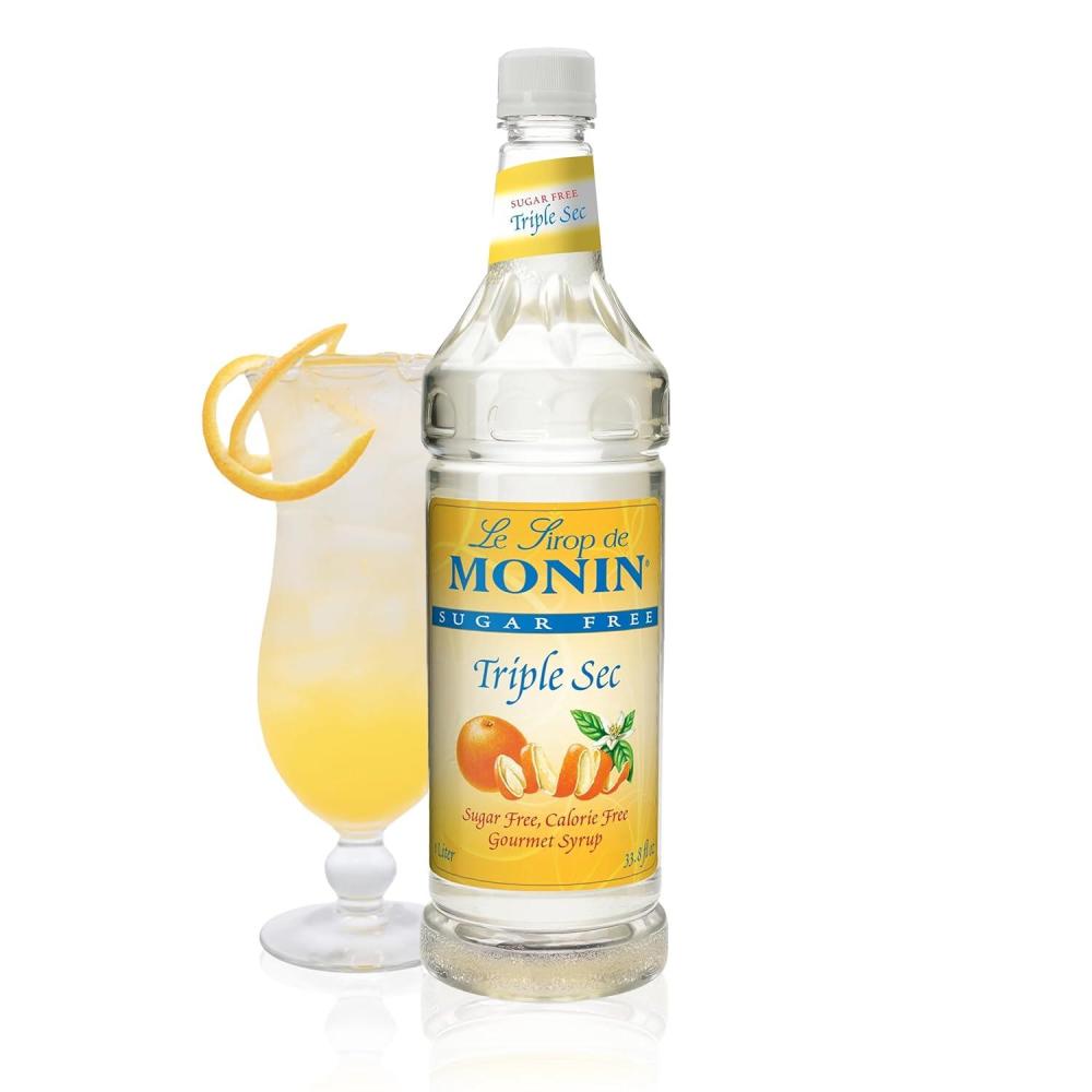 image:imageMonin Sugar Free Blue Raspberry Syrup Premium CalorieFree Syrup Perfectly Sweet amp Tart for Slushes Cocktails Mocktails amp Snow Cones BPAFree Plastic Bottle 338 fl ozSugar Free Triple Sec
